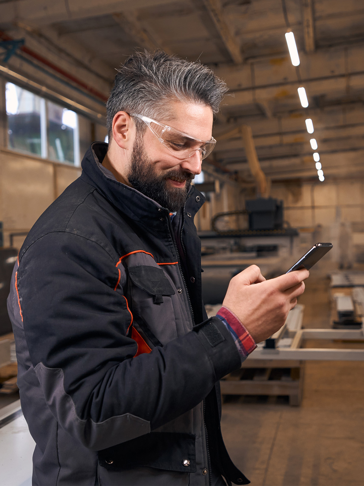 Immediate Reach - Man in woodshop managing his business